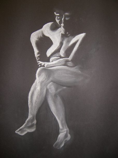 A life drawing of an elderly lady on black paper in white chalk. 